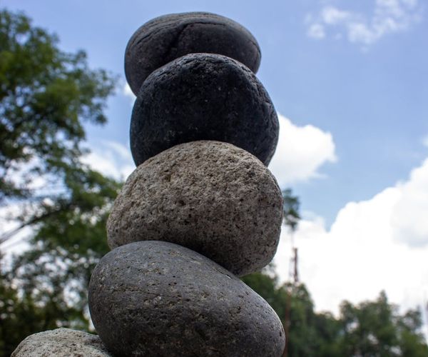 A serene scene showing balanced stones, representing physical and mental equilibrium.
